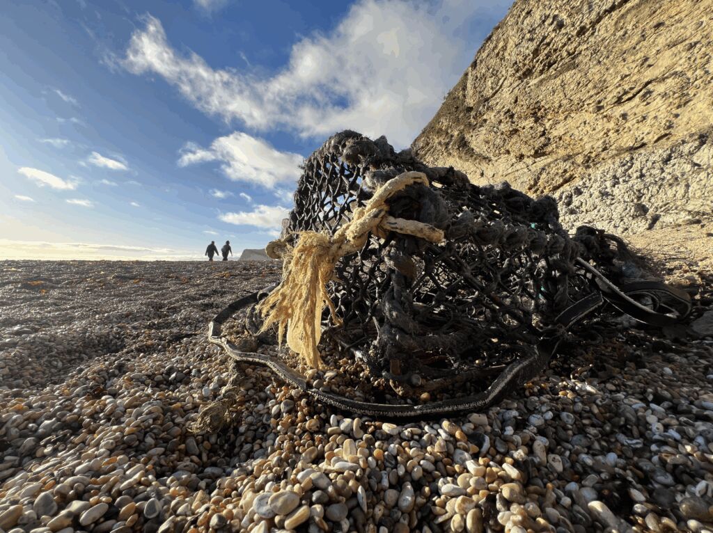 Ghost gear: a lost fishing pot washed up on the beach at Durdle Door